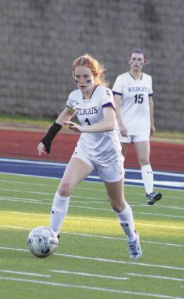 Anna Williams (1) kicks the ball during the Lady Wildcats’ Area playoff game against Palestine this past season. Williams was recently tabbed Second-Team All-Region by the Texas Association of Soccer Coaches (TASCO). Williams was also named Midfield of the Year by District 13-4A. Photos by DJ Spencer