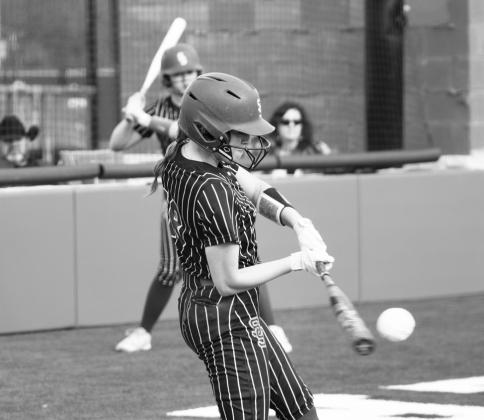 Senior Nicole Higgins (18) takes a big cut off of a pitch during recent action. In her final home game, Higgins batted 2/3, recorded five RBIs, and scored two runs in the Lady Wildcats' 15-0 win over Liberty-Eylau Tuesday, including a three-run home run. Photo by DJ Spencer