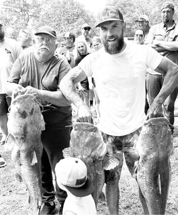 Elbert and Michael Fenton took the top spot for the three-fish stringer in the 4th Annual “The Op Masters”catfish tournament with three flatheads weighing 138.4 pounds — a new tournament record. The event has raised more than $50,000 for charity. Courtesy Photo/The Op Masters