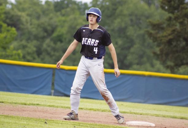 Senior Kaleb White (4) weighs his options on the basepaths during the Bears' game against Miller Grove Thursday. In his final home game, White batted 1/2, recorded two RBIs, and scored a run in the Bears' 14-4 victory, helping them cap off a perfect district season. Photo by DJ Spencer