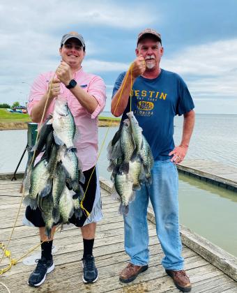 Tillman and Tanner Bostick proudly display the mess of fish caught at the park. TP&amp;WD Photo