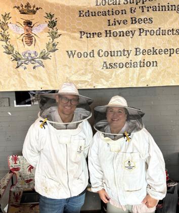 Keegan Wyatt, Beekeepers program coordinator, and Aubrie Jones, Association Vice-president, model bee suits.