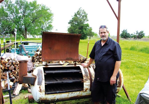 Glenn Norfleet is building a new barbecue pit to replace his current one. Staff Photo by Tammy Vinson