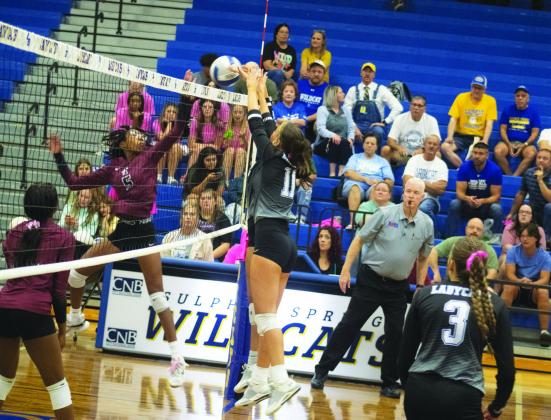 NOT TODAY — Senior Kate Monk (11) blocks the ball during the Lady Wildcats' game against Liberty-Eylau Tuesday. In her senior night game, Monk came up with five kills, three blocks, two assists, one ace, and one dig. Photo by DJ Spencer