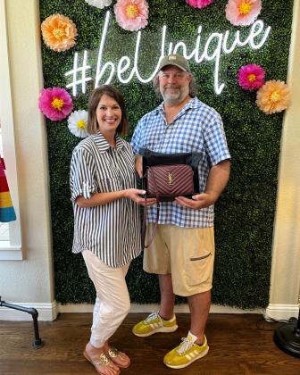 Everything Unique owners Carrie and Steve Nuckolls can’t wait to see who wins the bag they are sponsoring for the Hopkins County Health Care Foundation’s Designer Handbag Bingo. This YSL stunner is sure to make the winner happy.