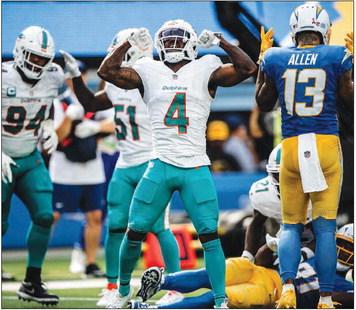 GREAT PLAY — Current Miami Dolphins cornerback and Texas A&M-Commerce alumnus Kader Kohou (4) celebrates following one of his tackles during the Dolphins' game against the Los Angeles Chargers last Sunday. Kohou is in his second season with Dolphins, who play the New England Patriots Sunday night. Submitted Photo