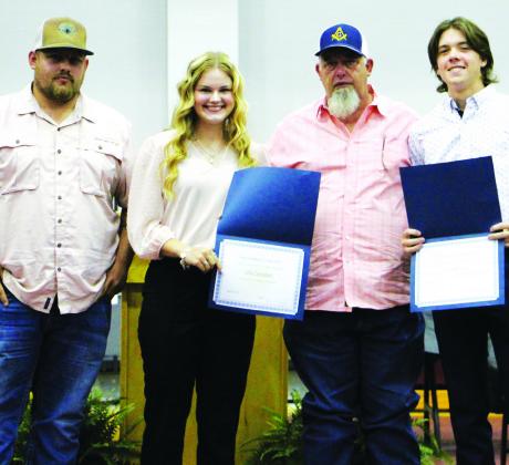 (Above) Cumby Masonic Lodge members Hunter Cash and Robert Cash award $4,000 scholarships to Cumby Collegiate High School seniors Lilly Campbell and Lane Mc-Craw. See Page 10 for more scholarship photos from the Cumby Collegiate awards program. Staff Photos by Tammy Vinson