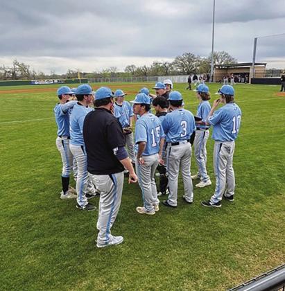 The Como-Pickton Eagles discuss their game plan during their game against Cumby Monday. The Eagles soared to a 15-1 victory over the Trojans, sweeping Cumby for the season. Courtesy/ Como-Pickton CISD