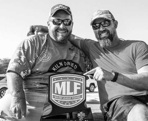 Well-liked in the fishing world, Hunter Baughman celebrates his remarkable win with long-time friend and tournament roommate, Josh Shirley.