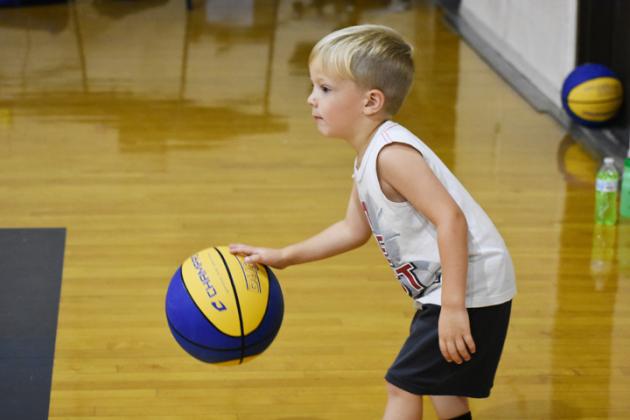 August Sanders perfects his dribbling during the second day of the Sulphur Springs Wildcat Basketball Camp.