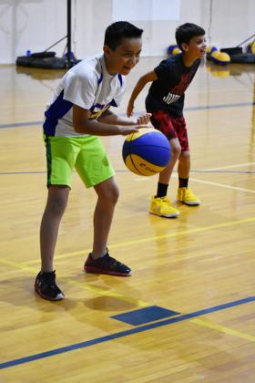 Gilbert Martinez (left) and Jensen Jumper (right) prepare for the next drill during the second day of the camp.
