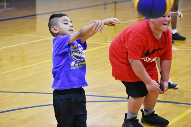 Xavier Guerra works on his passing during the annual Wildcat Basketball Camp.