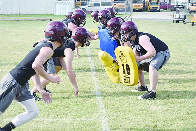 The Cumby offensive and defensive fronts run through a drill during Monday’s practice. The Trojans open their 2019 season on the road Aug. 30 against Quitman. Staff photos by Quinten Boyd