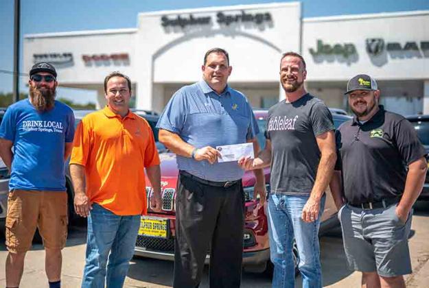 In an official presentation to Sulphur Springs Independent School District, a check for $4,500 was given after the Back To School Burger Bash fundraiser hosted by Tableleaf. Those present were (from left) Grayson Wing, head brewer at Backstory Brewery; Scott Nottingham, owner, Sulphur Springs Chrysler Dodge RAM Jeep; Mike Lamb, SSISD superintendent; Logan Vaughan, owner, Tableleaf; and David Slaughter, owner, Slaughter’s BBQ Oasis. Courtesy/Logan Vaughan