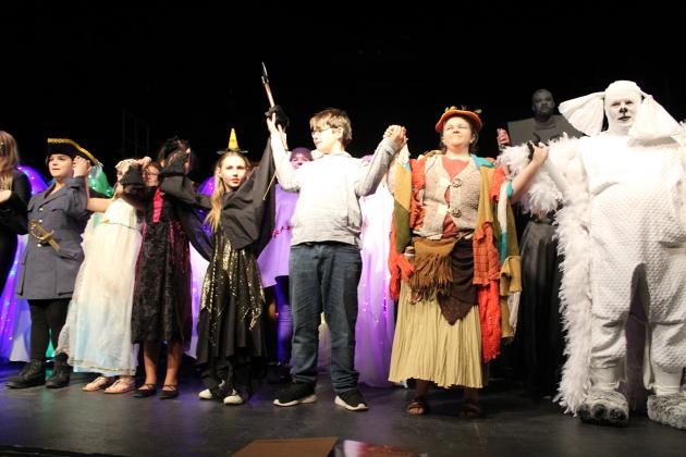 The Neverending Story cast bows during the curtain call.