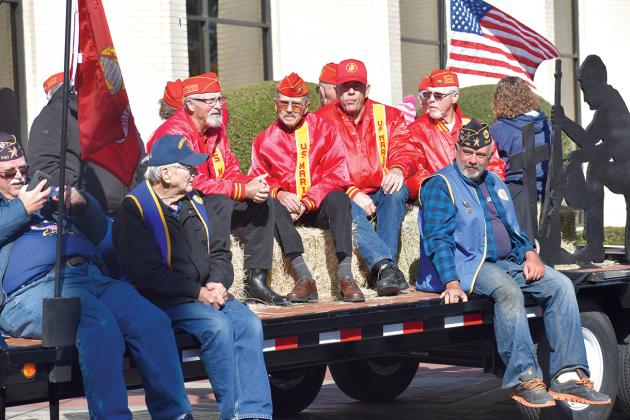 Members of the Hopkins County Marine Corps League Detachment 1357 rode through downtown Sulphur Springs in the Veterans Day Parade held Saturday. For more photos of the parade, see page 10A or go online t ssnewstelegram.com. In the red jackets are (from left) Larry Vickers, Chuck Jones, Jerry Wilhite and Garry Hall. Staff photo by Jillian Smith