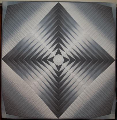 "Grey Ombre" is the title of the quilt Floyd and Wilma Moss have entered into competition for the American Quilter's Society's annual competition.