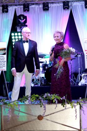 Lights of Life Gala campaign chairs David and Pam Black welcome guests and honorees alike to the 2020 Mardi Gras celebration Saturday at the Hopkins County Regional Civic Center. Attendees spent the night in glittering style, complete with a New Orleans parade. Staff photo by Taylor Nye