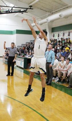 Isaiah Billingsley shoots a 3-pointer Friday night in their homecoming win over Savoy. Staff photo by Tyler Lennon