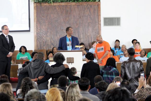 Sulphur Springs city council member Rev. Harold Nash (center) read a proclamation during the Martin Luther King Jr. celebration and social justice awards presentation for the family of Jimmie Lurleene Harrison, former Sulphur Springs educator who passed away Dec. 16, 2019, held at Morning Chapel Missionary Baptist Church Monday evening.