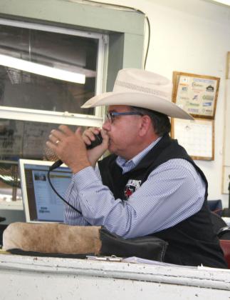 Auctioneer Joe Don Pogue takes bids from a limited audience and over the internet during the May Northeast Texas Beef Improvement Organization preconditioned cattle sale Wednesday at the Sulphur Springs Livestock Commission market.
