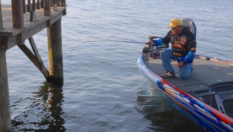 Crappie fishing expert Wally Marshall prepares to shoot a jig beneath a dock on Toledo Bend. Done correctly, Marshall says shooting will catapult the jig at a low angle, parallel to the water, with enough velocity that it will sail far beneath the dock. Courtesy/Matt Williams