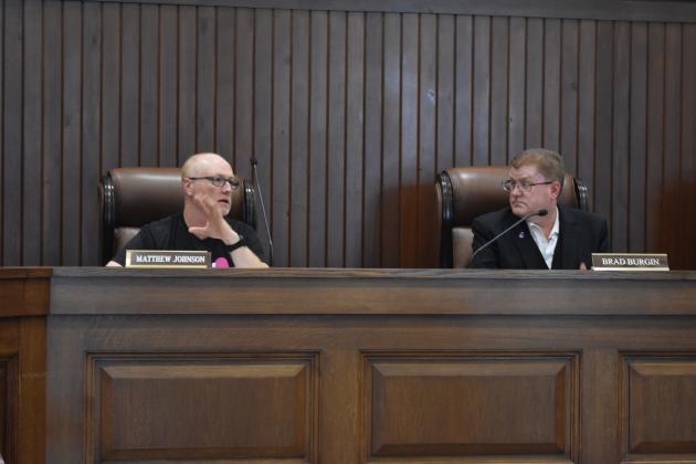 ZBA members (from left) Matthew Johnson and Chair Brad Burgin vote on a three-car garage/ Staff photo by Todd Kleiboer
