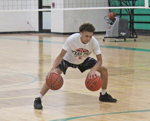 Kobe Robertson works on ball handling drills Tuesday, as he prepares for his senior season. Robertson was a focal point of the Hornets offense in his junior year and was named first team all-district. Robertson is very strong with the ball in his hands, constantly setting up opportunities for both himself and his teammates to score.
