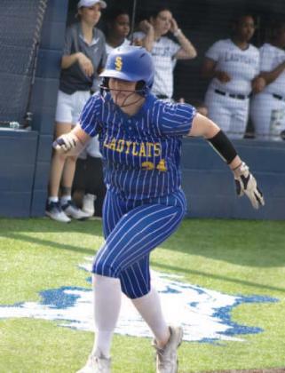 Claire Thompson (34) barrels towards home plate during earlier road action. Thompson batted 1/2, scored two runs, and recorded two RBIs in the Lady Wildcats' 17-0 victory against Liberty-Eylau Friday. Photo by DJ Spencer