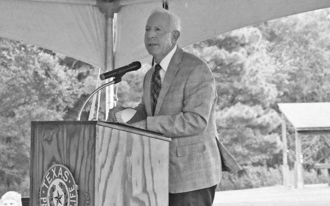 Hopkins County Judge Robert Newsom speaks at the ceremony marking the 25th anniversary of Cooper Lake State Friday morning. Staff photo by Todd Kleiboer