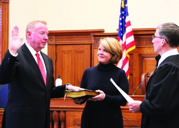 John Ginn, newly appointed Hopkins County Court at Law Judge, takes his official oath of office, administered by Texas 8th Judicial District Judge Eddie Northcutt, during a ceremony held Tuesday, Jan. 2 at the Hopkins County Courthouse. Staff photo by Tammy Vinson