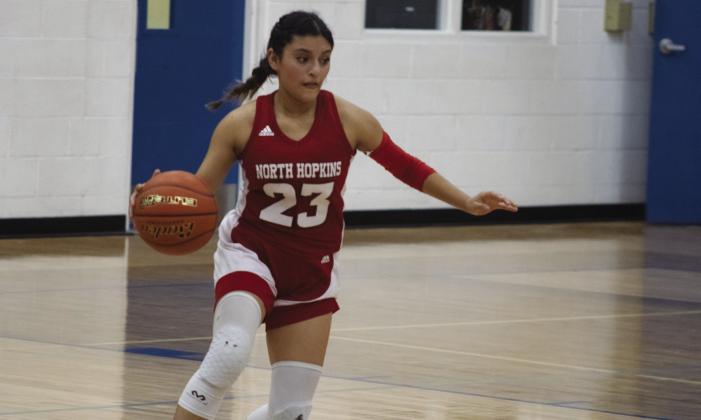 MAKING MOVES — Mariana Aguilar (23) moves the ball up the court during the Lady Panthers' game against Sulphur Bluff Monday. Aguilar scored five points in the Lady Panthers' 71-51 win. PhotobyDJSpencer