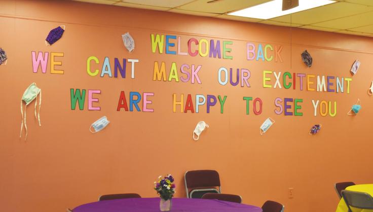 Senior Center director Karon Weatherman created a welcome wall for seniors returning to the center after it reopened Monday for regular activity. Staff photo by Ariel Phillips