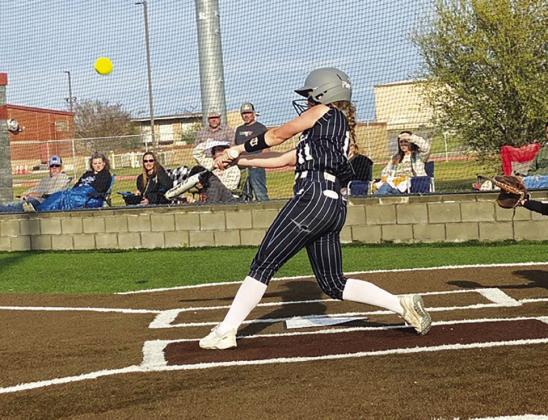 Paisley Watkins (11) takes a big cut off of a pitch during the Lady Eagles' game against Rivercrest Friday. Watkins batted 1/1, scored three runs, and recorded two RBIs in the Lady Eagles' 15-5 victory. Courtesy/ Como-Pickton CISD