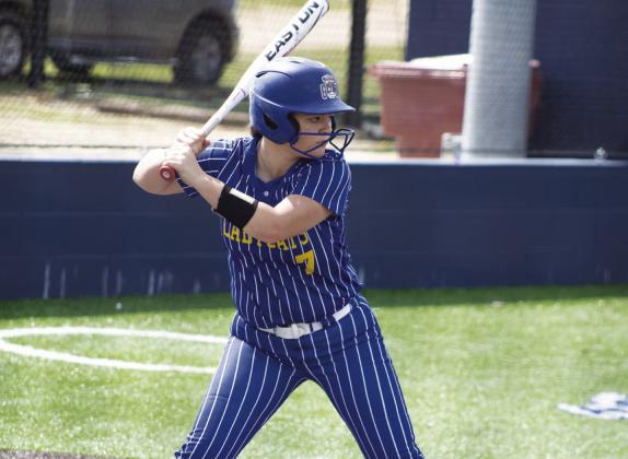 Bayler Boatman (7) prepares to take a swing at a pitch during recent road action. Boatman batted a perfect 5/5 in the Lady Wildcats' 17-8 win over North Lamar Saturday, adding four RBIs and scoring two runs. Photo by DJ Spencer