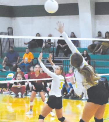 Lainy Burnett attempts a kill as Jaci Roberson readies herself at the net in the Tuesday home game against North Hopkins. Burnett led the team with 15 kills, and Roberson finished with six kills and an ace. Staff photo by Tyler Lennon