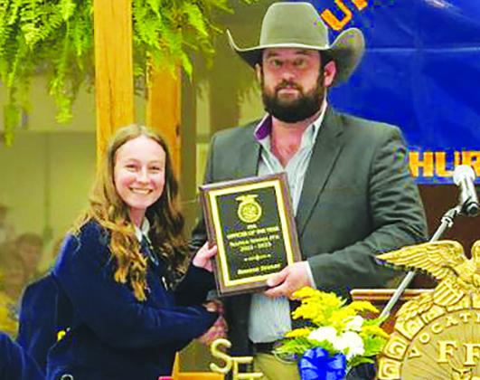 FFA AWARD John Holland, Sulphur Springs FFA Advisor, gives the Officer of the Year award to Rebekah Stanley at the recent banquet held for the group. Submitted photo