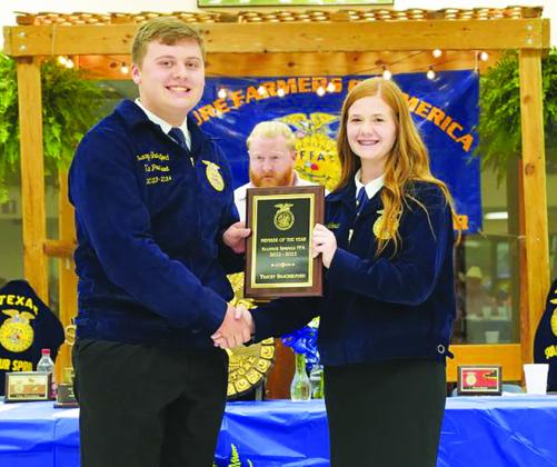 HONORS RECEIVED Sulphur Springs student Tracey Shackelford was named the Sulphur Springs Future Farmer of America Member of the Year. He is shown receiving a plaque from Mattye Schmidt at the recent FFA banquet. Submitted photo