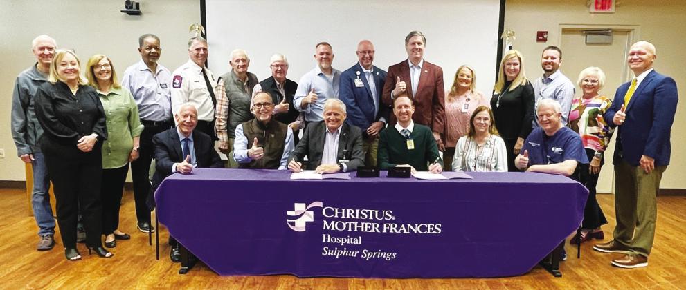 CHRISTUS Mother Frances Hopspital-Sulphur Springs, CHRISTUS Trinity Clinic and Texas A&amp;M University staff, along with members of the community gather as CMFH-SS President Paul Harvey and Sulphur Springs High School Principal Brad Moughon sign the official agreement to launch the Rural Medicine partnership program between the hospital, Sulphur Springs ISD and Texas A&amp;M University.