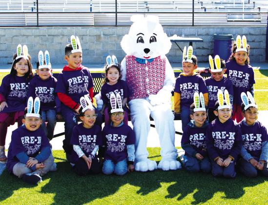 Douglass Early Childhood Learning Center students enjoy meeting the Easter Bunny and hunting eggs during the Easter egg hunt hosted by Sulphur Springs High School Key Club on the field at Herald Prim Stadium Thursday. Staff Photo by Tammy Vinson