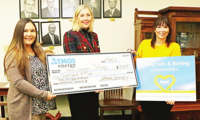 From left, PJC Director of Institutional Advancement Baleigh McCoin and Dr. Pam Anglin, PJC President, receive a $10,000 donation from Atmos Energy Corporation Manager of Public Affairs Elizabeth Dattomo recently. Part of Atmos Energy’s Fueling Safe and Thriving Communities program, the donation creates scholarships for PJC students pursuing careers in early childhood education. Courtesy photo