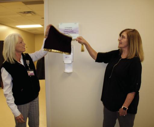CHRISTUS Mother Frances Hospital-Sulphur Springs Chief Nursing Officer Anitha Sanderson and Hopkins County Health Care Foundation Board of Directors Chair Maleta Reynolds unveil the sign for the new CT scanner at the hosptial.