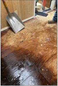 (Above) The March 3 storm knocked dozens of bricks off the western wall of the Hopkins Lodge No. 180 building in Cumby. The building was heavily damaged, but Lodge members were able to make repairs. (Left) The floors of the Masonic Lodge No. 180 in Cumby sustained heavy water damage during a severe thunderstorm Friday, March 3.