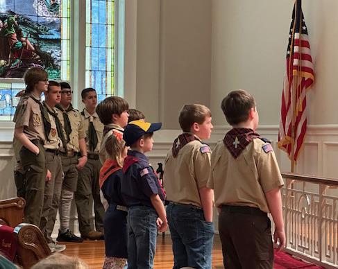 (Above) During the Sunday, Feb. 11, Scout Sunday service at First United Methodist Church, the Sulphur Springs Boy Scouts of America Troop 69 presented the colors. (Below) Troop 69 Sr. Patrol Leader Cameron Brown led the Pack and Troop in the Pledge of Allegiance and Scout’s Oath. In celebration of the 100th anniversary, Brown invited the congregation to a baked potato luncheon prepared and served by scouts in the Fellowship Hall following the service.