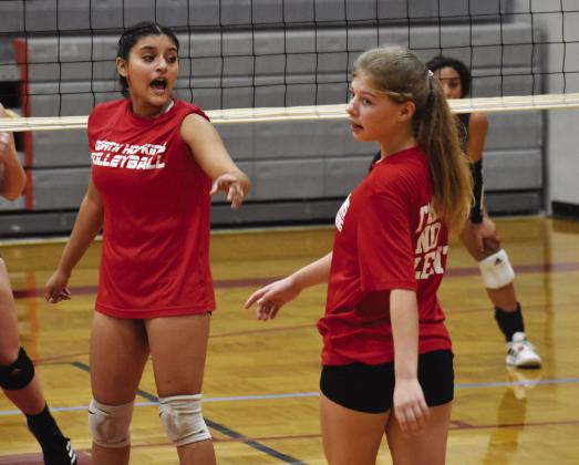 Mariana Aguilar (left) and Harley Vaughn (right) direct players to their positions during one of the scrimmages. Photo by DJ Spencer