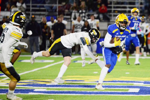 CJ Williams (5) takes off as a Forney defender dives and misses his legs. Williams has a spectacular night, leading the receivers with 12 receptions and 129 yards. Staff photos by Todd Kleiboer