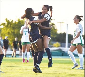 GOAL CELEBRATION — Nia Chacon (7) hugs Hannah Bell (6) following Bell's goal during the Lions' game against North Texas last Sunday. Despite this goal, the Lions would suffer a 3-1 loss to the Mean Green. Submitted Photo