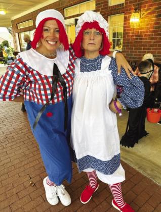 Wesley House Activity Director Kristie Gregory and hairdresser Krista Dillon pose as Raggedy Ann and Andy.