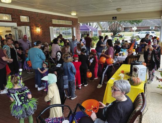 Children and adults enjoy the Halloween carnival at Wesley House.