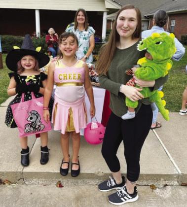 Mary Hennson, Layla Henson and Hailey Williamson with Khiree King as the green dinosaur.